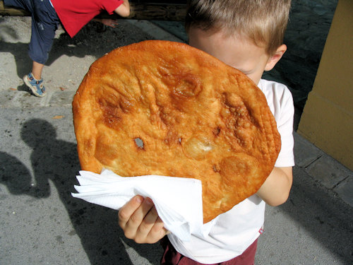 Kid eating a langos