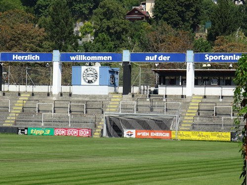 The Friedhofstribüne seen through the rear stadium gates
