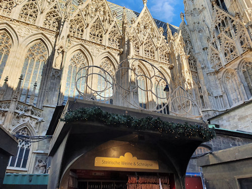 Wine and schnapps stall with cathedral behind