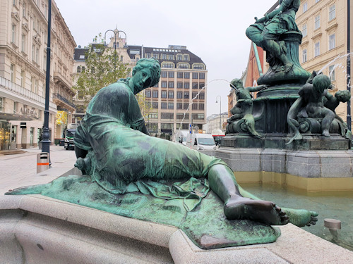 River statue at the side of a fountain