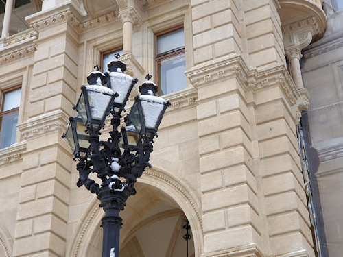 Snow-covered lanterns in front of the Rathaus