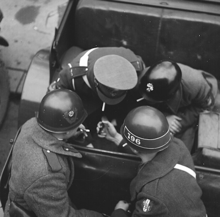 Four MPs in a jeep on a smoke break