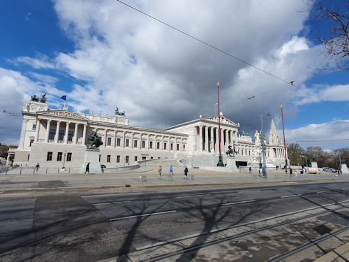 Full view of the parliament building in Vienna in the sun