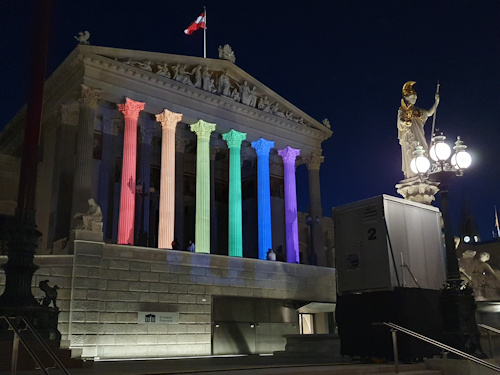 Austrian parliament building showing the pride colours