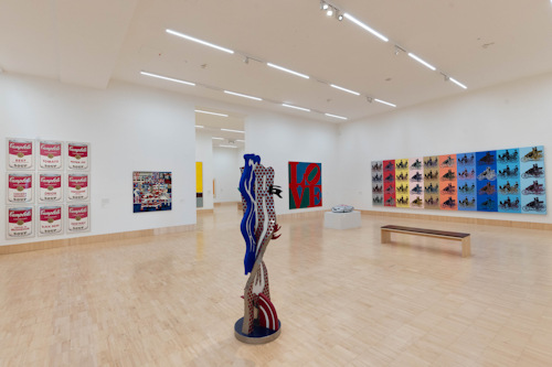 Warhol and Lichtenstein works in an exhibition