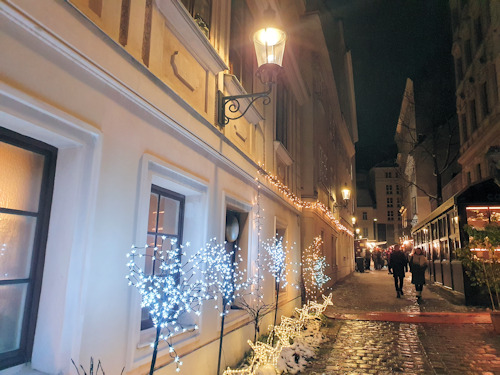 Christmas lights and lantern along an alley