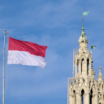 Flag of Vienna next to a neogothic tower