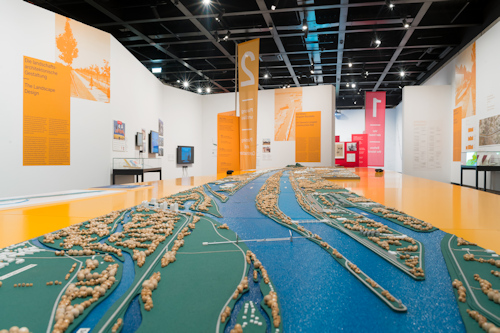 Exhibition view with a river model