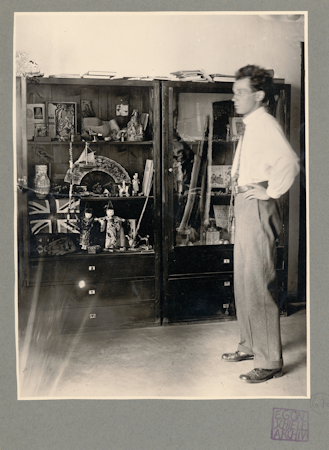 Man standing in front of a display cabinet