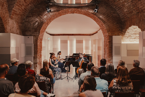 Ensemble performing classical music with an audience
